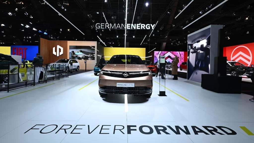 Opel unveils its “Electric All In” initiative at the 2025 Brussels Motor Show, showcasing the electrified Grandland, Frontera, and Mokka SUVs, making EVs more accessible.