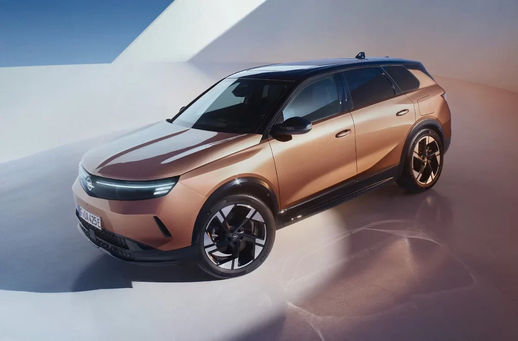 Opel unveils its “Electric All In” initiative at the 2025 Brussels Motor Show, showcasing the electrified Grandland, Frontera, and Mokka SUVs, making EVs more accessible.