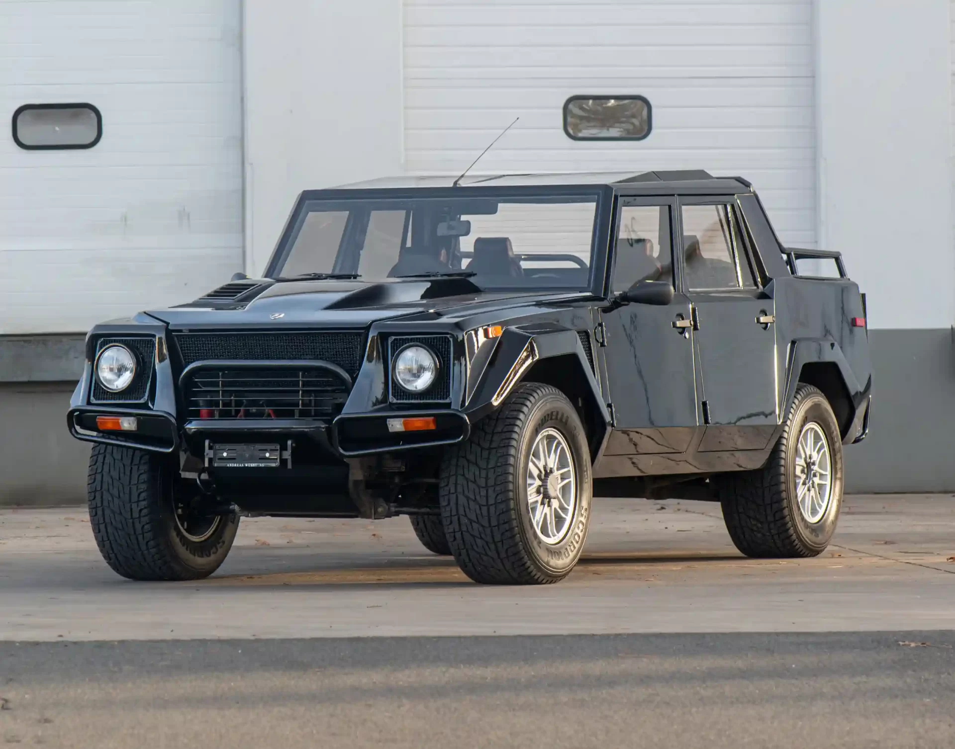 A rare 1993 Lamborghini LM002, known as the "Rambo Lambo," is for sale at £370,000. With a Countach V-12 engine, only 300 made, and just 14,078 miles, it’s an SUV icon!