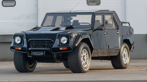 A rare 1993 Lamborghini LM002, known as the "Rambo Lambo," is for sale at £370,000. With a Countach V-12 engine, only 300 made, and just 14,078 miles, it’s an SUV icon!