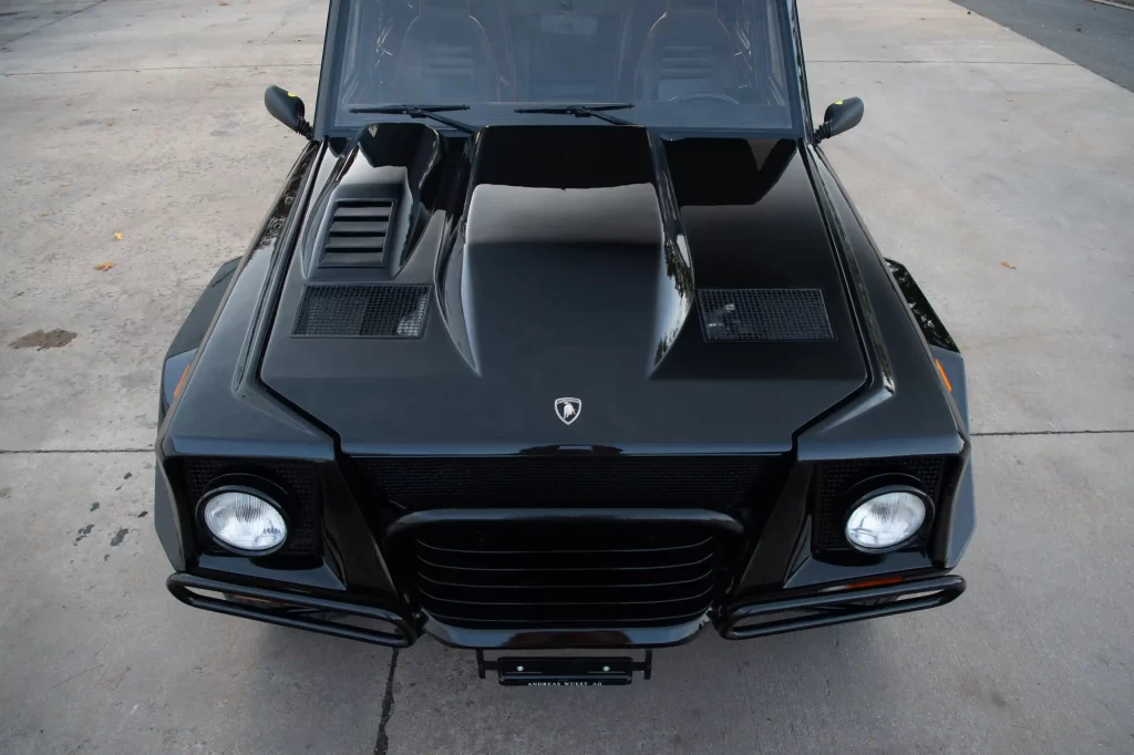 A rare 1993 Lamborghini LM002, known as the "Rambo Lambo," is for sale at £370,000. With a Countach V-12 engine, only 300 made, and just 14,078 miles, it’s an SUV icon!