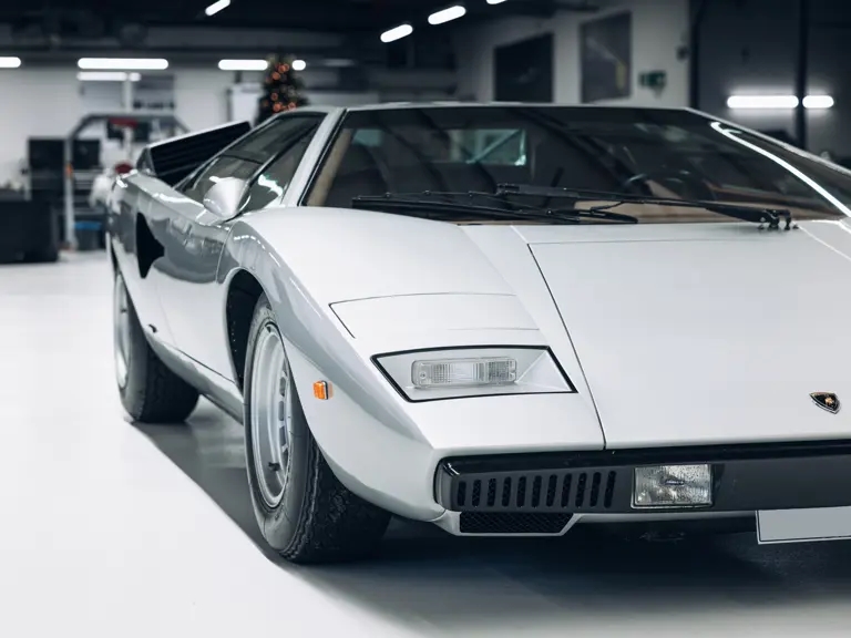 A rare 1975 Lamborghini Countach LP400 'Periscopio' is up for auction at £750K. One of just 157 made with a unique periscope mirror, it's a collector's dream!