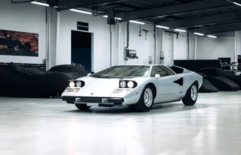 A rare 1975 Lamborghini Countach LP400 'Periscopio' is up for auction at £750K. One of just 157 made with a unique periscope mirror, it's a collector's dream!