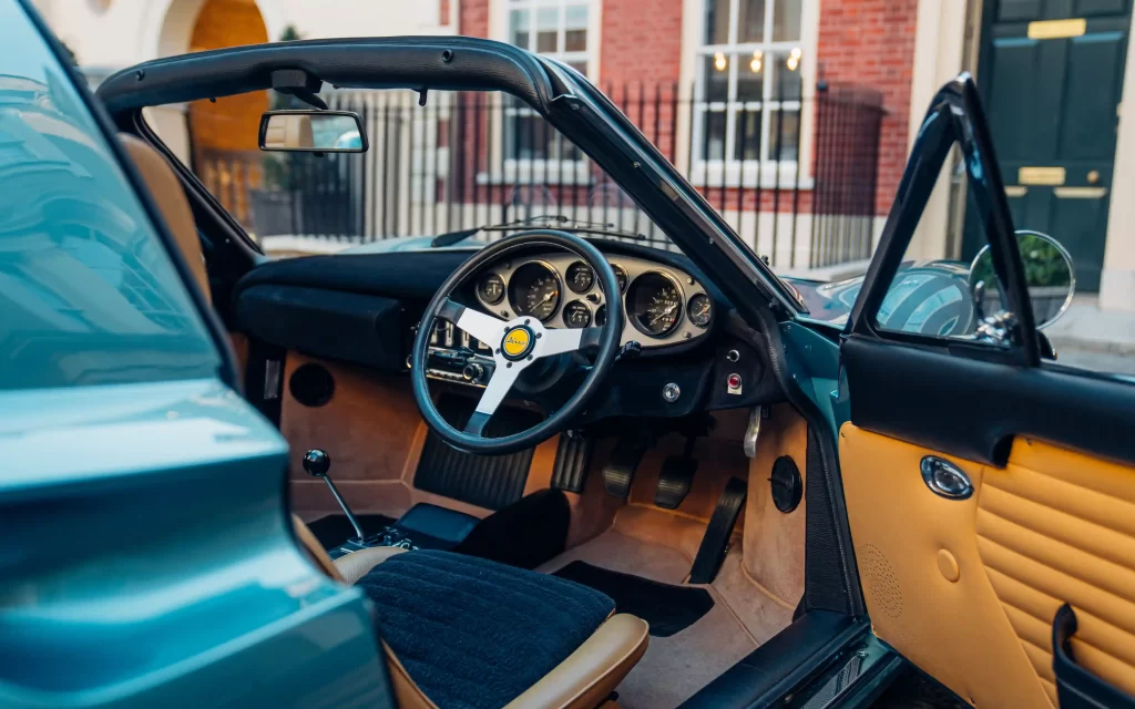 A rare 1973 Ferrari Dino 246 GTS in stunning Bleu Chiaro Metallizzato, once owned by British racing icon Digby Martland, is up for sale in Chobham for £480,000.