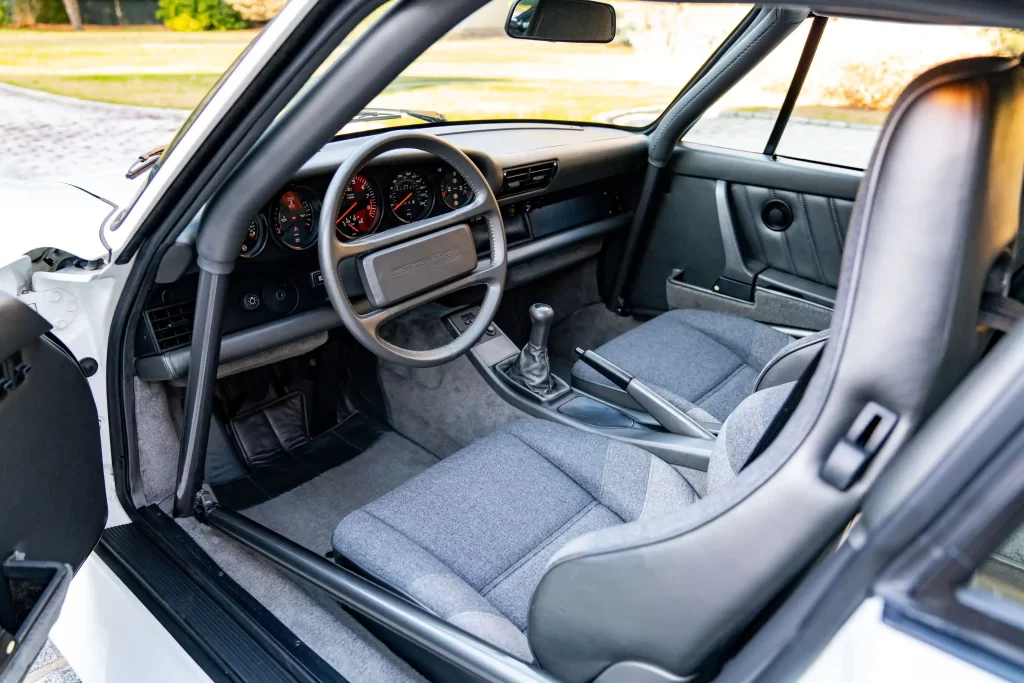 A rare 1988 Porsche 959 Sport, one of just 29 ever made, is set to sell for £5.26 million at RM Sotheby’s in Miami. The 211mph supercar remains highly sought after.