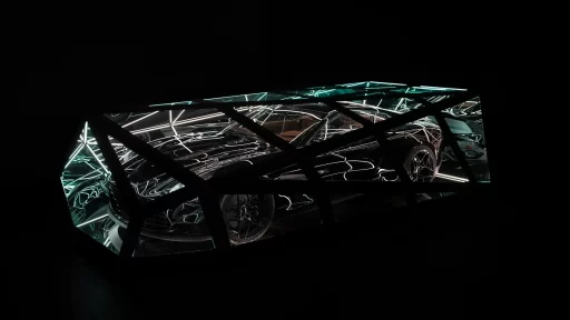 Aston Martin Vanquish inspires *Reflections of Speed*, a striking light sculpture by Anthony James, blending art and engineering in a tribute to design and performance.