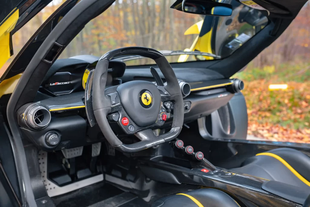 A rare yellow Ferrari LaFerrari - one of just nine ever made - is up for auction at £3.2M. With only 2,149 miles, this 963bhp hybrid hypercar is a collector's dream!