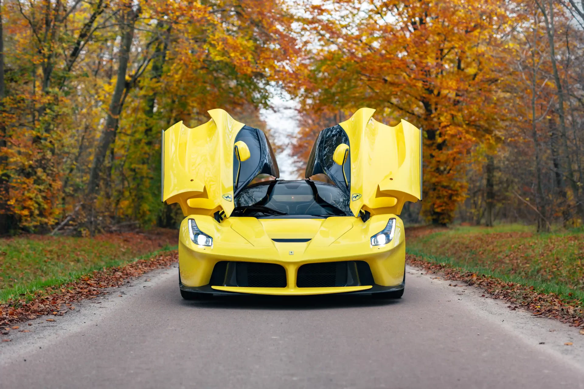 A rare yellow Ferrari LaFerrari - one of just nine ever made - is up for auction at £3.2M. With only 2,149 miles, this 963bhp hybrid hypercar is a collector's dream!