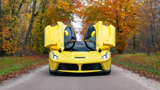 A rare yellow Ferrari LaFerrari - one of just nine ever made - is up for auction at £3.2M. With only 2,149 miles, this 963bhp hybrid hypercar is a collector's dream!