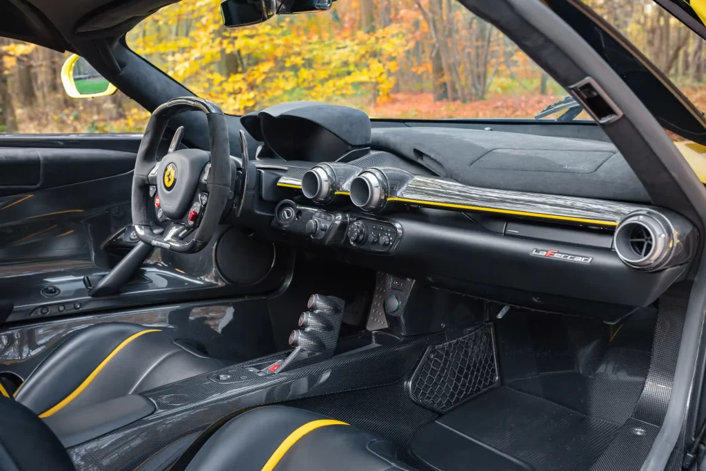 A rare yellow Ferrari LaFerrari - one of just nine ever made - is up for auction at £3.2M. With only 2,149 miles, this 963bhp hybrid hypercar is a collector's dream!