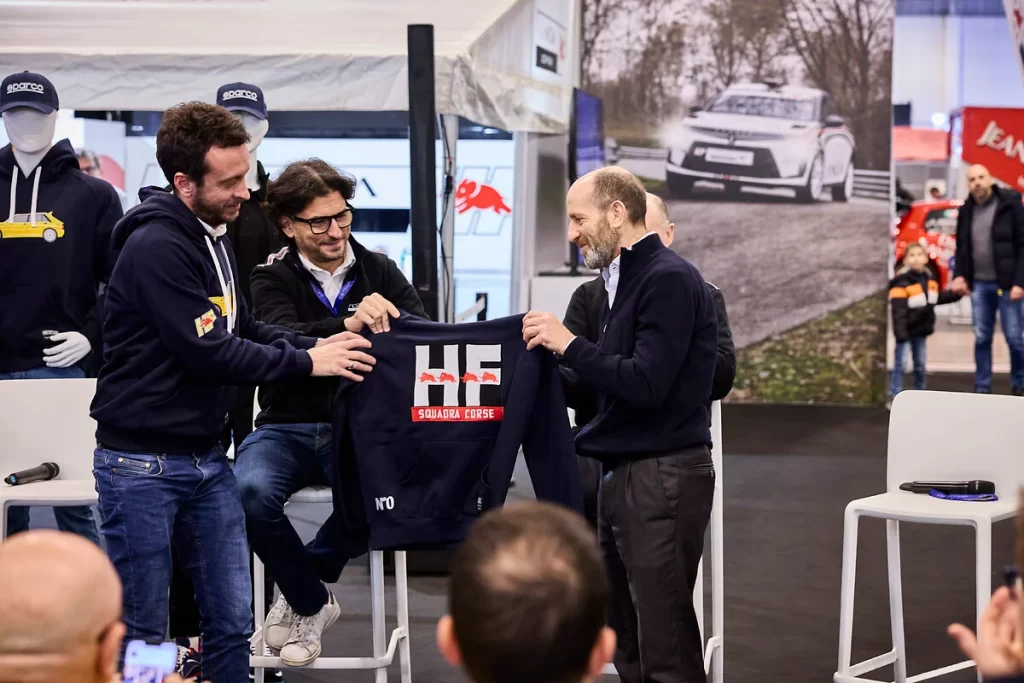 Lancia and Sparco revive their motorsport legacy with a new HF sportswear line, unveiled at the Rally Racing Meeting alongside Lancia’s return to rally competition.