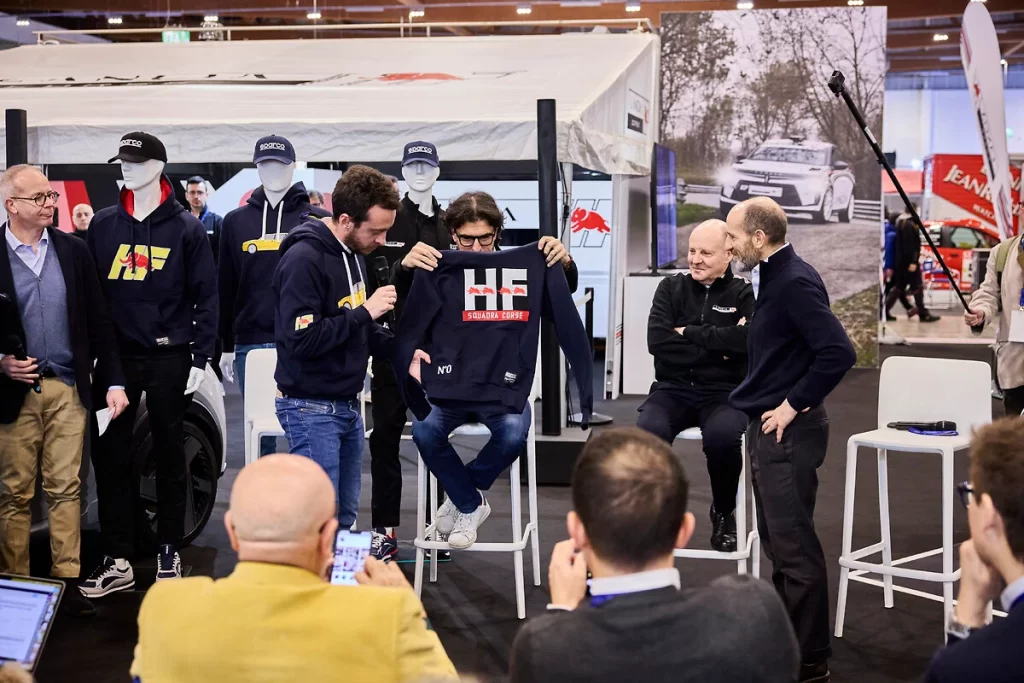 Lancia and Sparco revive their motorsport legacy with a new HF sportswear line, unveiled at the Rally Racing Meeting alongside Lancia’s return to rally competition.