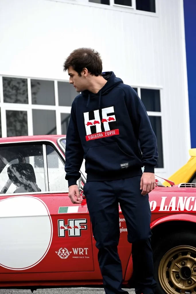 Lancia and Sparco revive their motorsport legacy with a new HF sportswear line, unveiled at the Rally Racing Meeting alongside Lancia’s return to rally competition.