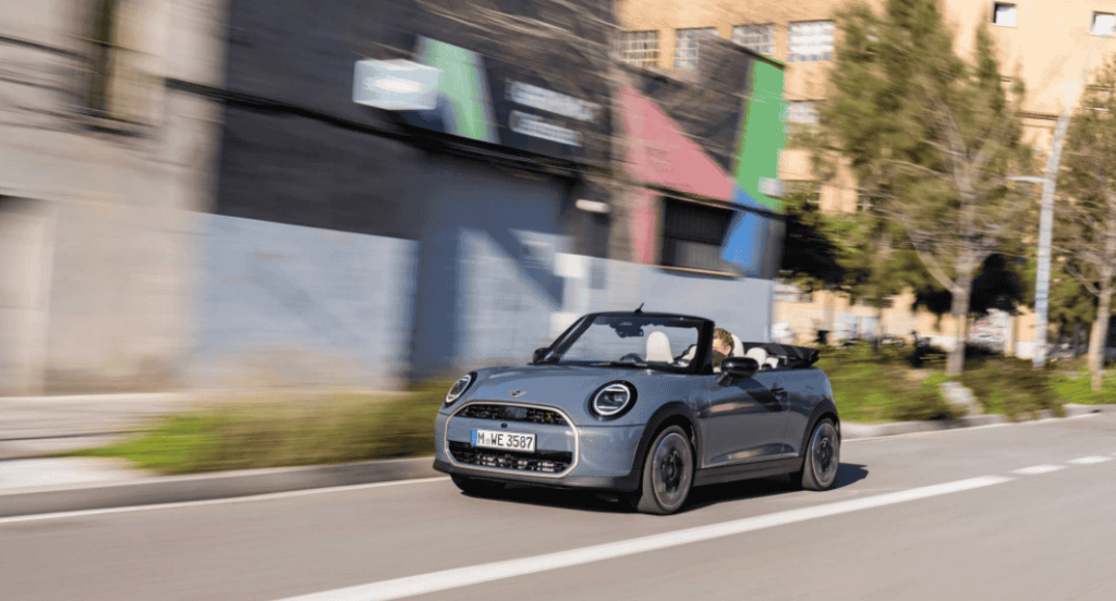 The MINI Cooper Convertible S in Copper Grey delivers open-air freedom with a 204 hp engine, a fully automatic roof, and a stylish design that shines under the Spanish sun.