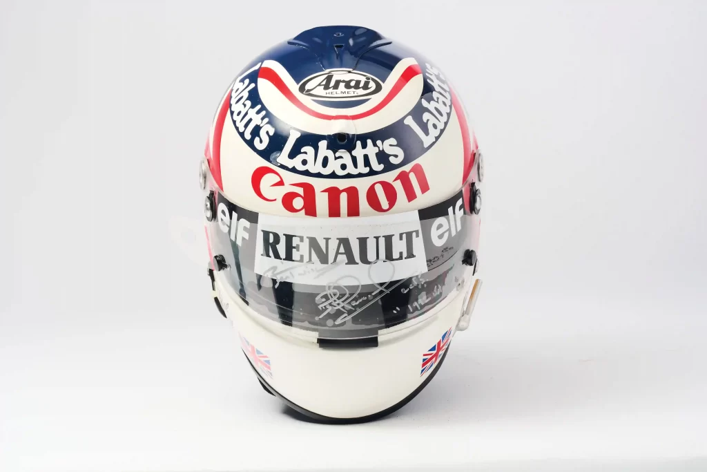 Nigel Mansell is auctioning prized F1 memorabilia, including his 1992 championship helmet and trophy, with items expected to fetch over £150,000 at RM Sotheby’s.