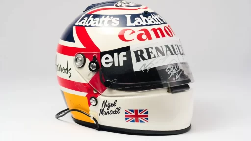 Nigel Mansell is auctioning prized F1 memorabilia, including his 1992 championship helmet and trophy, with items expected to fetch over £150,000 at RM Sotheby’s.