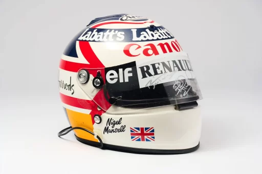 Nigel Mansell is auctioning prized F1 memorabilia, including his 1992 championship helmet and trophy, with items expected to fetch over £150,000 at RM Sotheby’s.