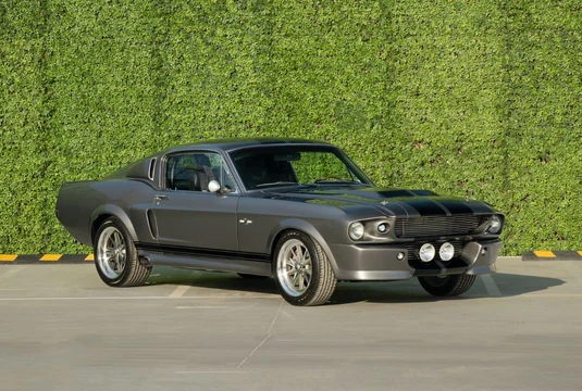 A 1967 Shelby Mustang GT500, an officially licensed Eleanor replica from Gone in 60 Seconds, is for sale in Dubai for £195,000, boasting 545 horsepower and iconic styling.