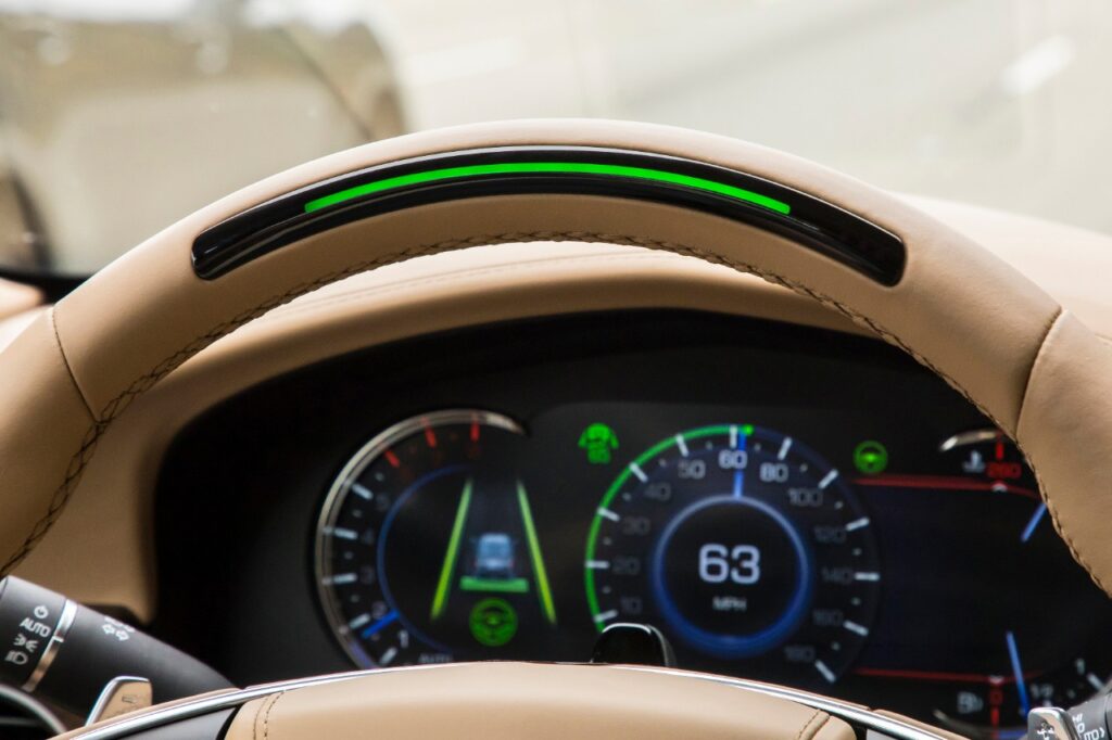 GM’s Super Cruise offers hands-free driving on 750,000 miles of roads by 2025, with features like automatic lane changes, trailering, and real-time driver monitoring.