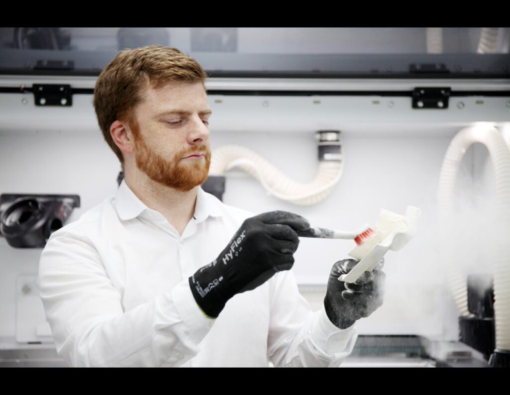 Bentley celebrates 25 years of Additive Manufacturing at its Crewe HQ, showcasing 3D printed gold, sustainability strides, and innovation driving its electric future.