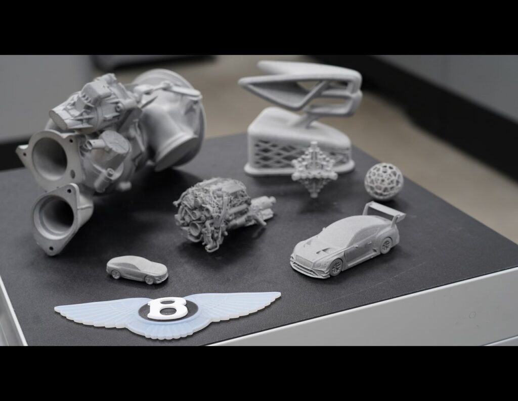 Bentley celebrates 25 years of Additive Manufacturing at its Crewe HQ, showcasing 3D printed gold, sustainability strides, and innovation driving its electric future.