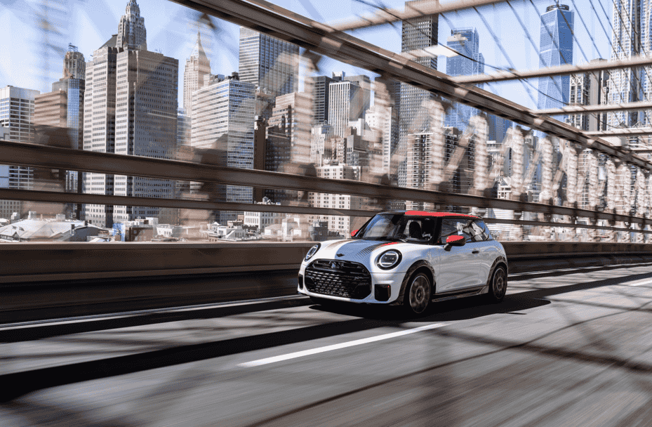 The MINI John Cooper Works brings 231 hp, bold Chili Red styling, and advanced tech to New York City, delivering sporty precision and standout design in every turn.