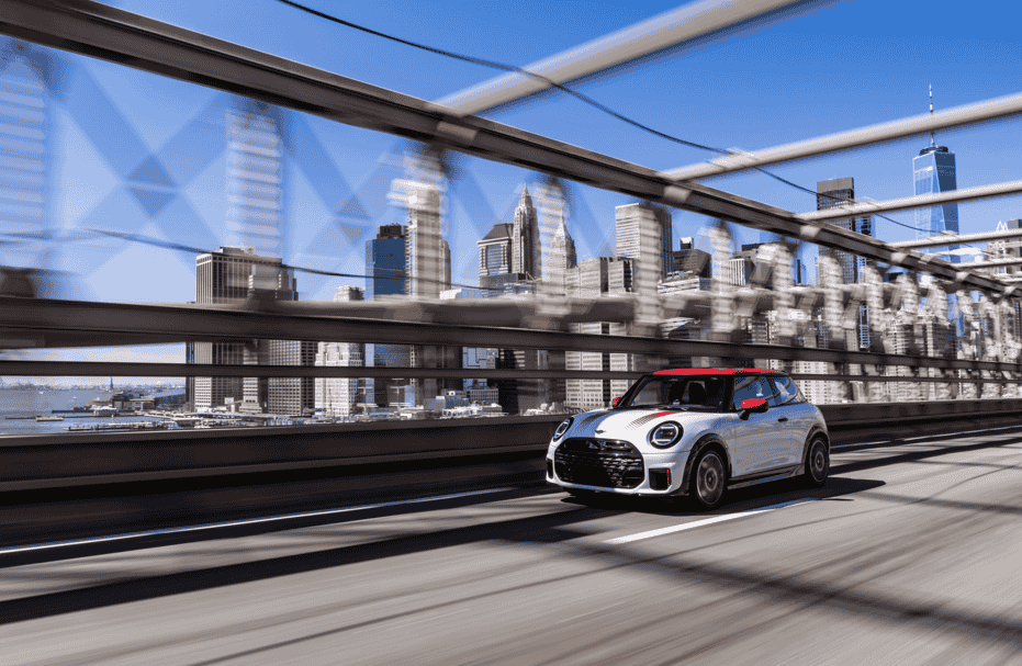 The MINI John Cooper Works brings 231 hp, bold Chili Red styling, and advanced tech to New York City, delivering sporty precision and standout design in every turn.