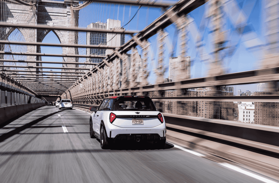 The MINI John Cooper Works brings 231 hp, bold Chili Red styling, and advanced tech to New York City, delivering sporty precision and standout design in every turn.