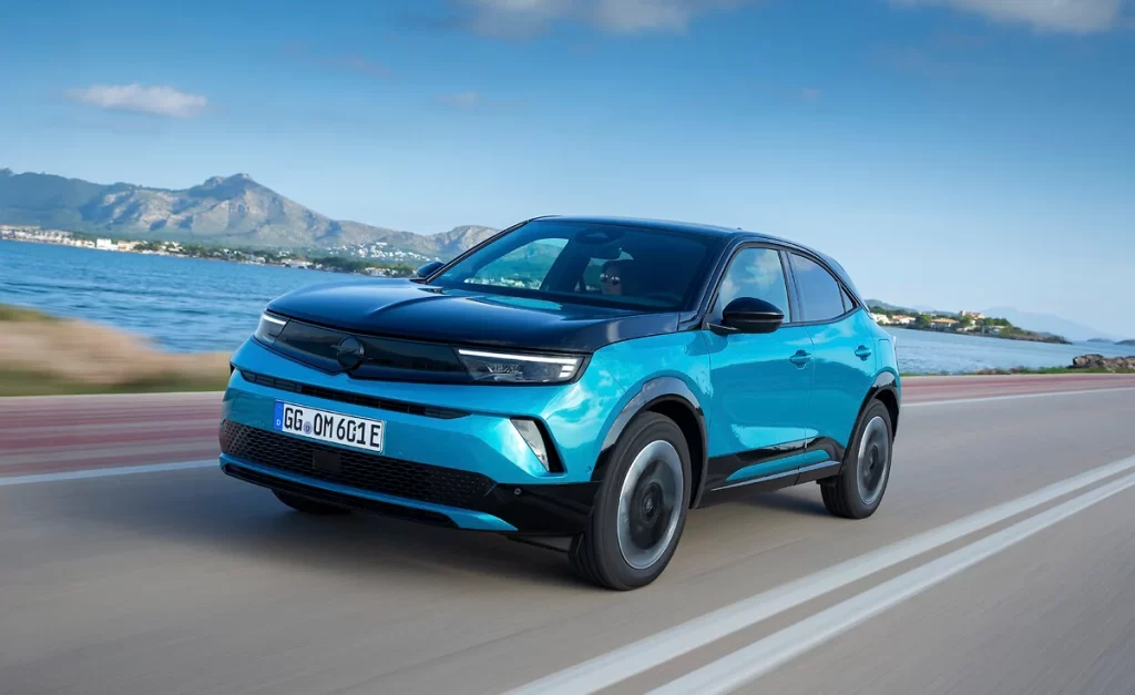 The 2026 Opel Mokka debuts bold new colors like Kolibri Blue and Tropikal Green, enhancing its stylish design while offering hybrid and electric options with eco features.
