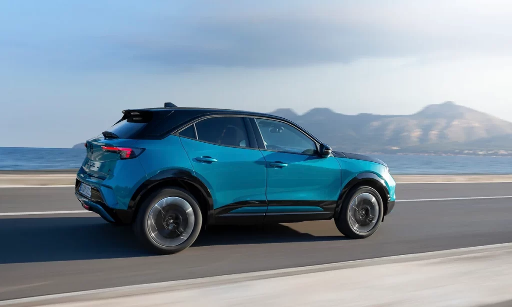The 2026 Opel Mokka debuts bold new colors like Kolibri Blue and Tropikal Green, enhancing its stylish design while offering hybrid and electric options with eco features.