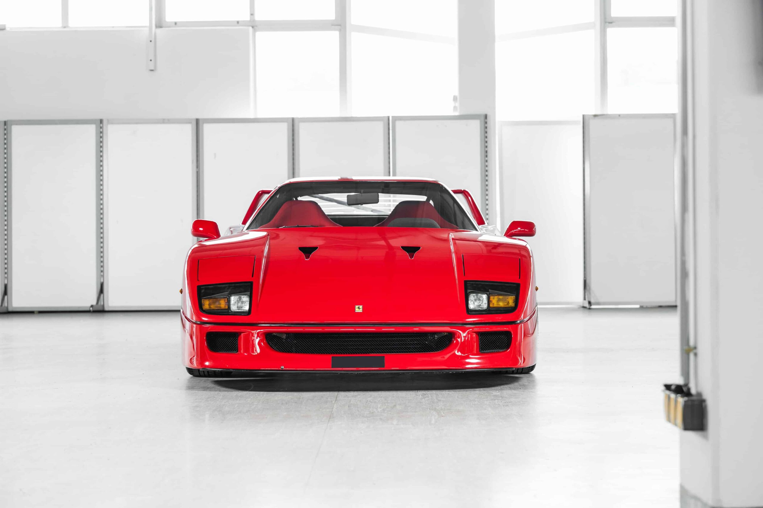 A rare 1989 Ferrari F40 with only 10,749 miles is set to sell for £2.3m at RM Sotheby’s Milan auction, potentially breaking the record for this iconic supercar.