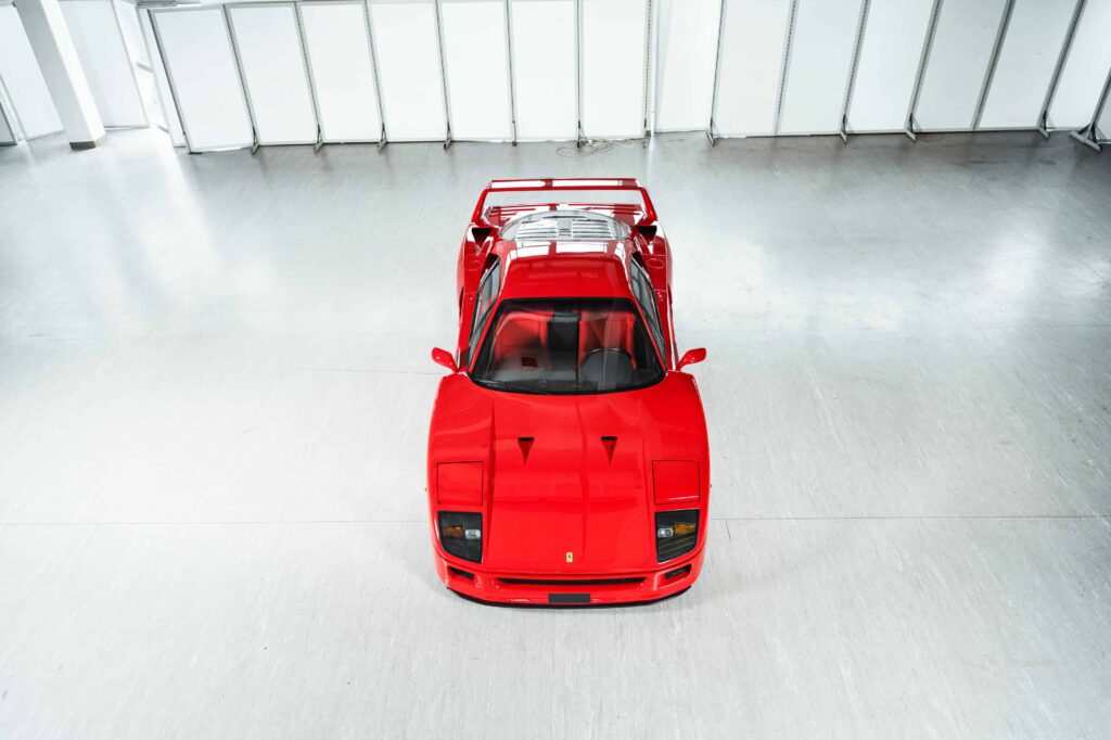 A rare 1989 Ferrari F40 with only 10,749 miles is set to sell for £2.3m at RM Sotheby’s Milan auction, potentially breaking the record for this iconic supercar.