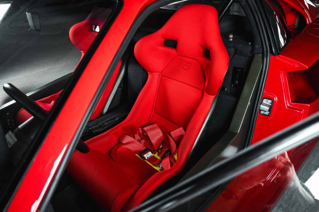 A rare 1989 Ferrari F40 with only 10,749 miles is set to sell for £2.3m at RM Sotheby’s Milan auction, potentially breaking the record for this iconic supercar.