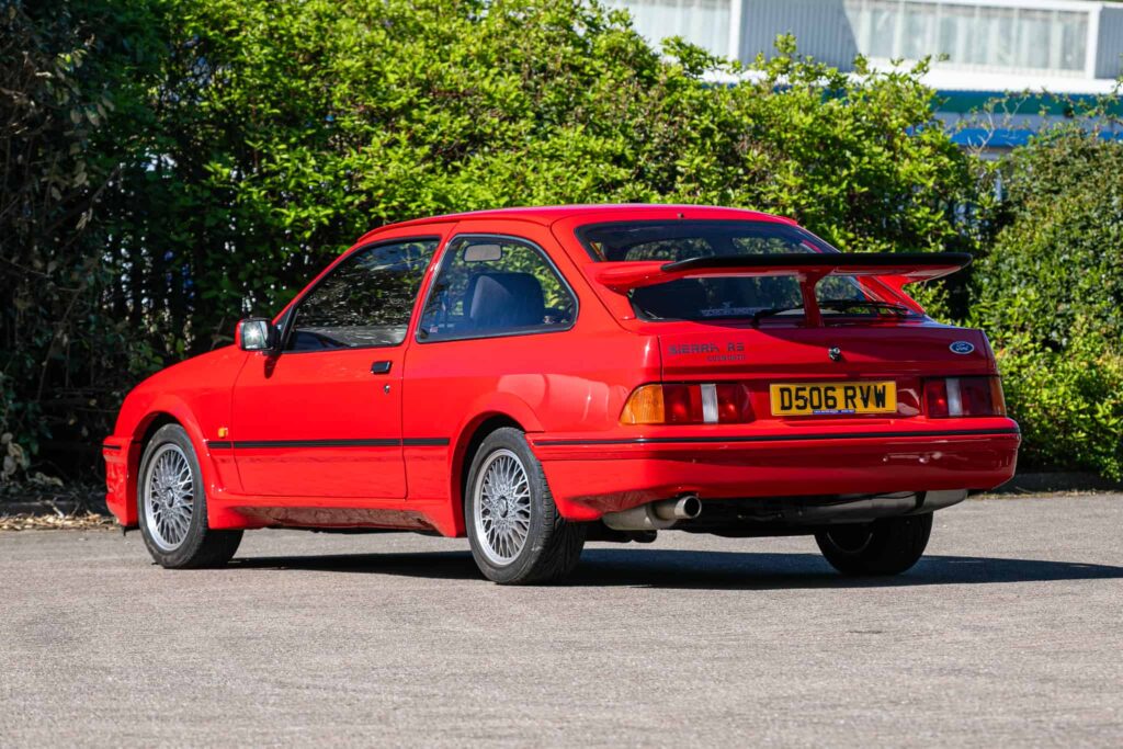 A rare Ford Sierra RS Cosworth in rosso red, once owned by a duke and racer, is set to fetch £90,000 at auction - over five times its original 1986 price.
