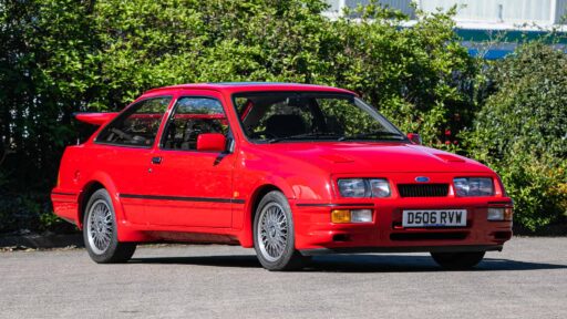 A rare Ford Sierra RS Cosworth in rosso red, once owned by a duke and racer, is set to fetch £90,000 at auction - over five times its original 1986 price.
