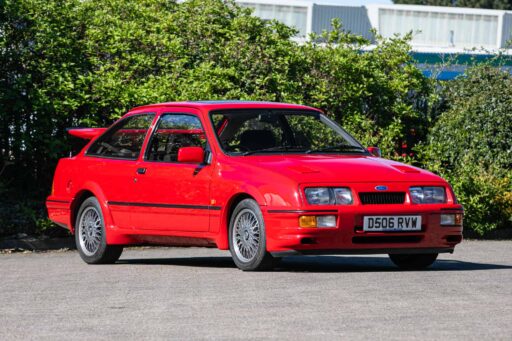 A rare Ford Sierra RS Cosworth in rosso red, once owned by a duke and racer, is set to fetch £90,000 at auction - over five times its original 1986 price.