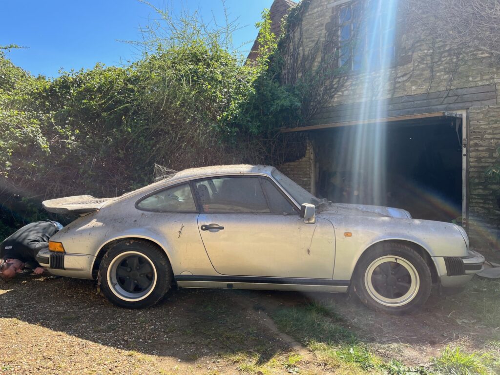 A barn-find 1989 Porsche 911 3.2 Carrera Sport with just 40,000 miles is up for sale at £25,000 after 14 years in storage, offering huge potential to collectors.