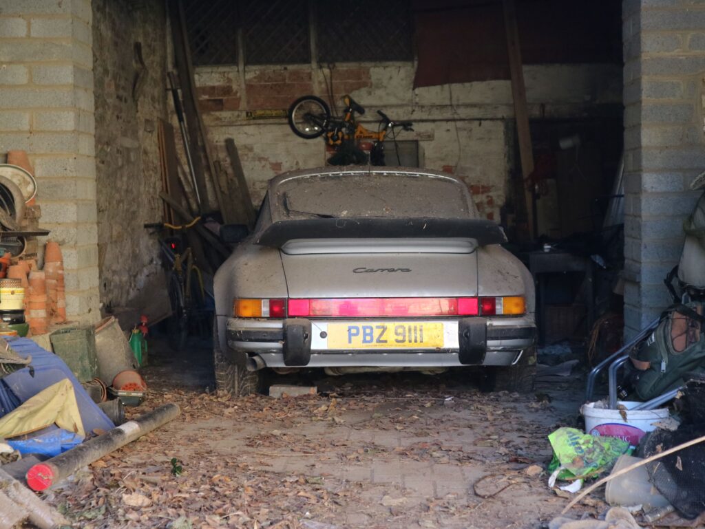 A barn-find 1989 Porsche 911 3.2 Carrera Sport with just 40,000 miles is up for sale at £25,000 after 14 years in storage, offering huge potential to collectors.