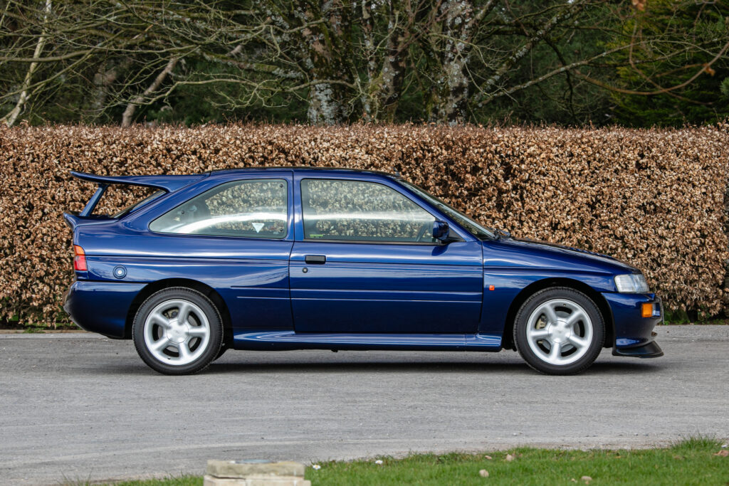 A rare 1993 Ford Escort RS Cosworth sold for £118,000 at auction, 12 times its original price, thanks to low mileage, one owner and iconic Big Turbo performance.