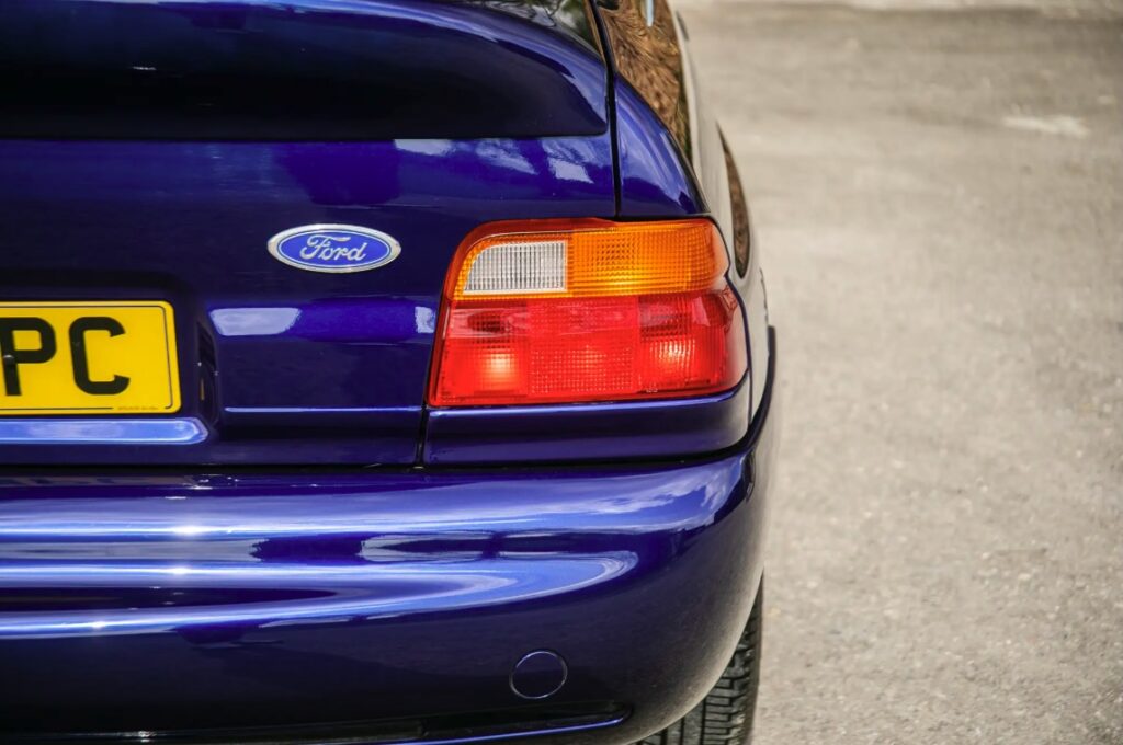 A rare 1993 Ford Escort RS Cosworth sold for £118,000 at auction, 12 times its original price, thanks to low mileage, one owner and iconic Big Turbo performance.