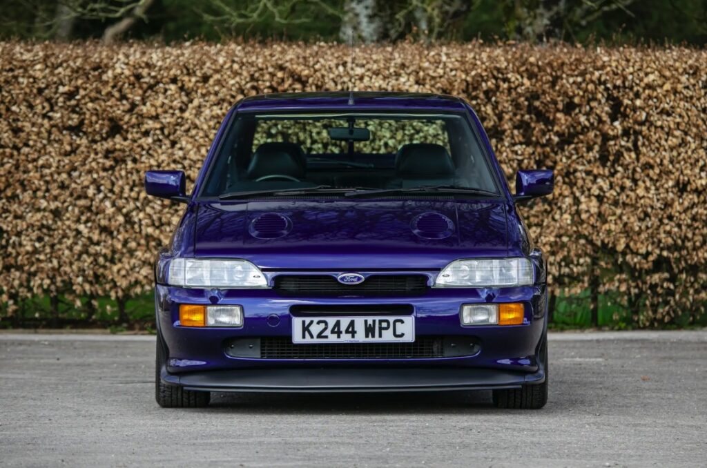 A rare 1993 Ford Escort RS Cosworth sold for £118,000 at auction, 12 times its original price, thanks to low mileage, one owner and iconic Big Turbo performance.