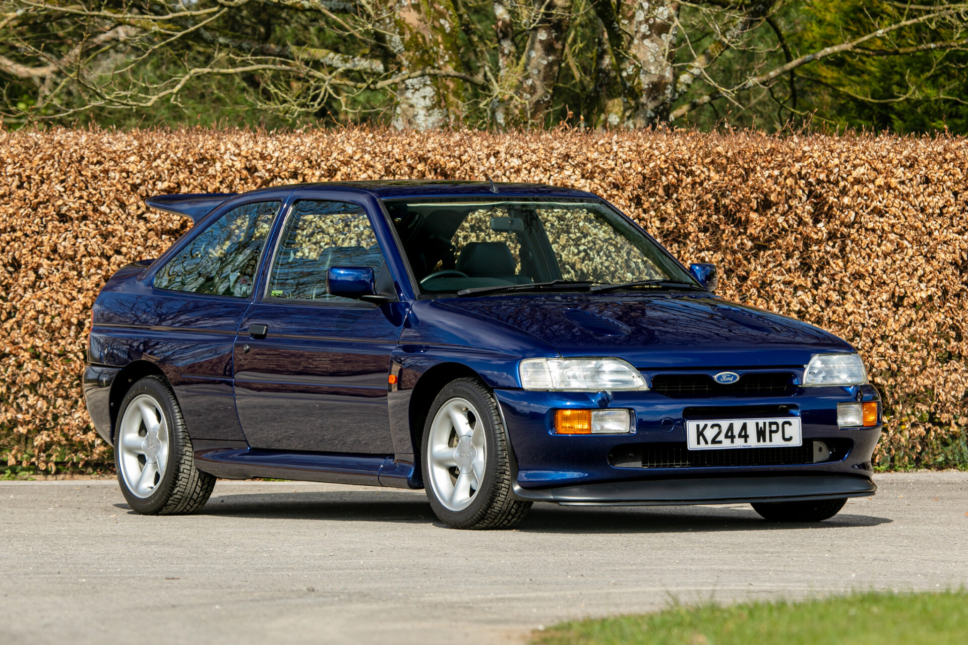 A rare 1993 Ford Escort RS Cosworth sold for £118,000 at auction, 12 times its original price, thanks to low mileage, one owner and iconic Big Turbo performance.