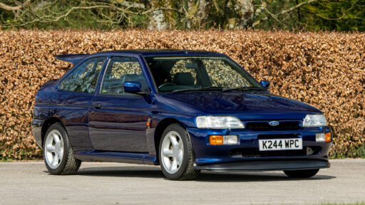 A rare 1993 Ford Escort RS Cosworth sold for £118,000 at auction, 12 times its original price, thanks to low mileage, one owner and iconic Big Turbo performance.
